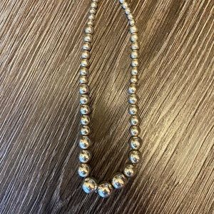 Sterling silver graduated small ball necklace.